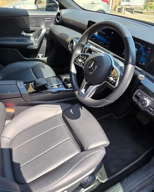 Inside the East London Learners automatic Mercedes A-Class — steering wheel, automatic gear selector and digital display